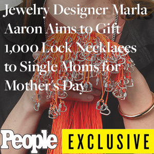 A Photo of a woman holding hearlock necklaces on orange cords with the title over it, "Jewelry Designer Marla Aaron Aims to Gift 1,000 Lock Necklaces to Single Moms for Mother's Day" and the People Magazine logo