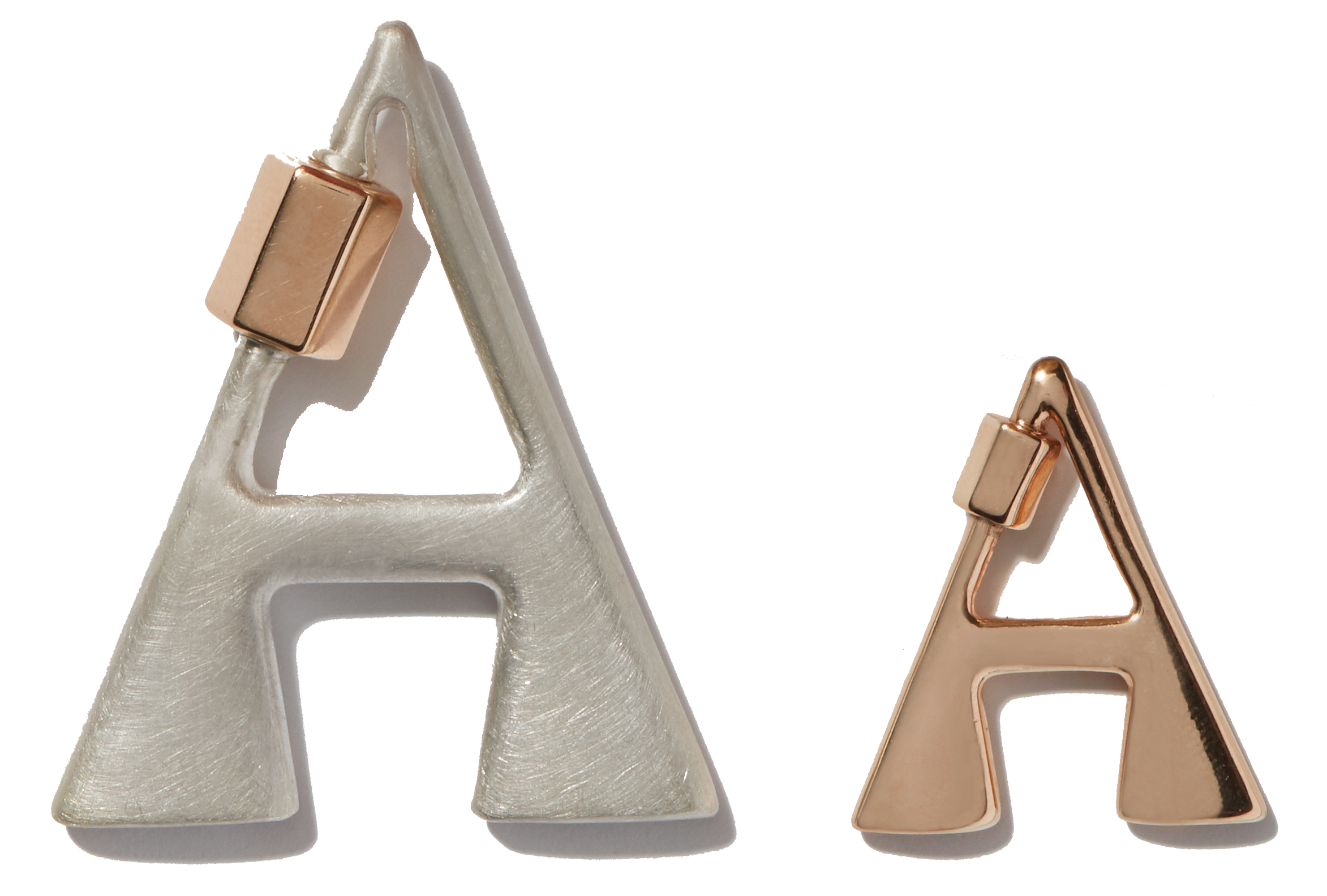 Large silver letter A charm alongside small rose gold letter A charm