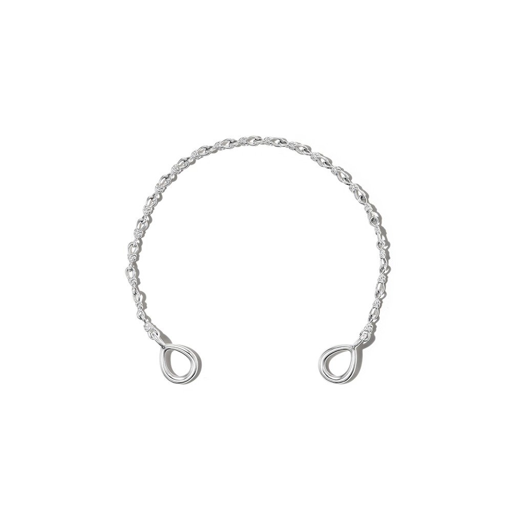 Silver love knot bracelet chain against white backdrop