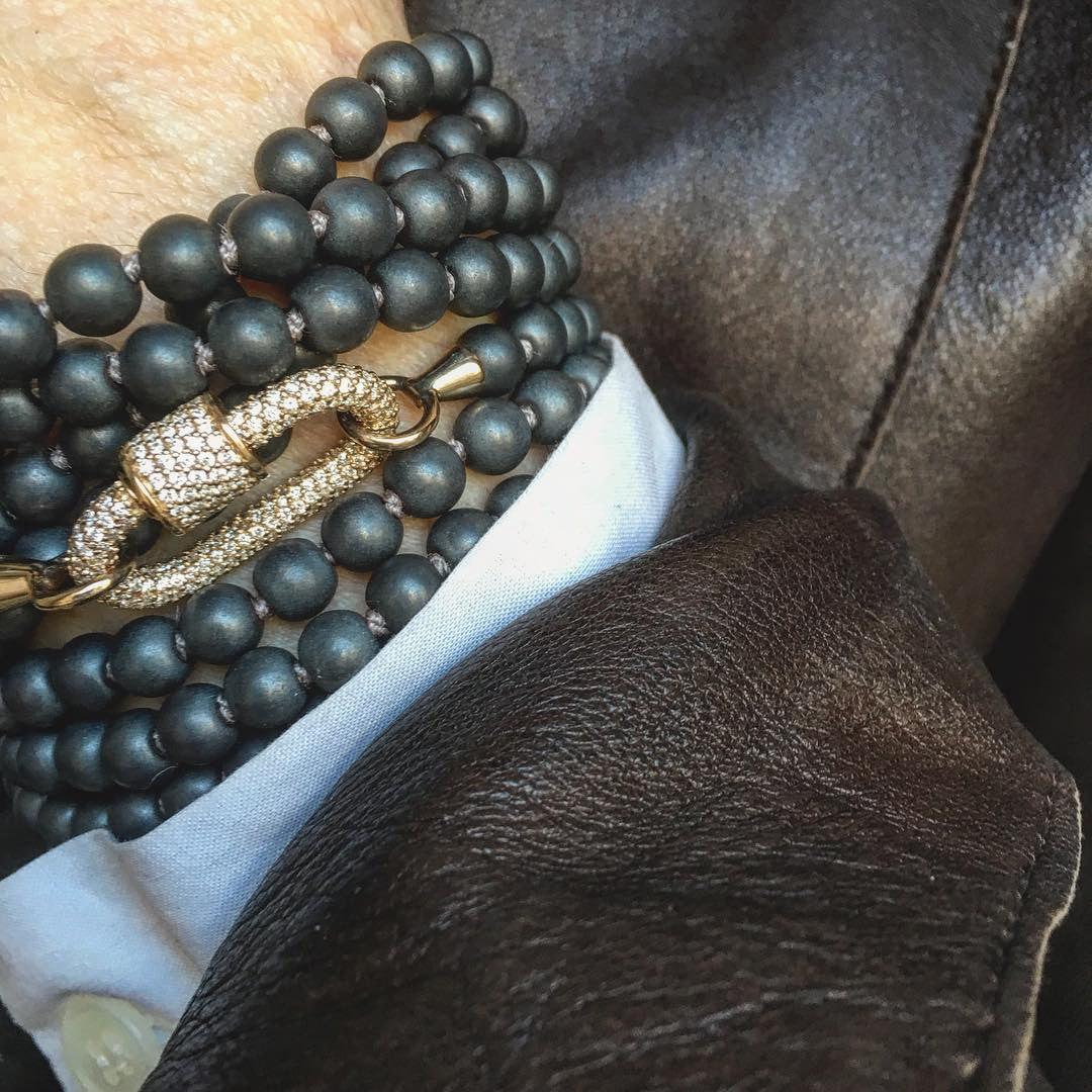 allstone diamond lock on a buffed hermatite strand wrapped multiple times to make a bracelet