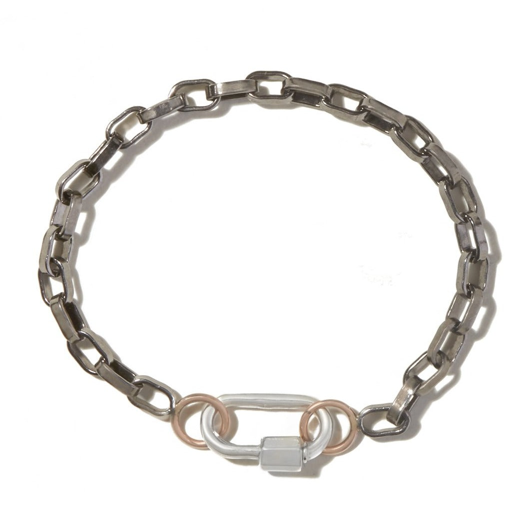 Blackened silver bracelet with rose gold loops and small silver lock