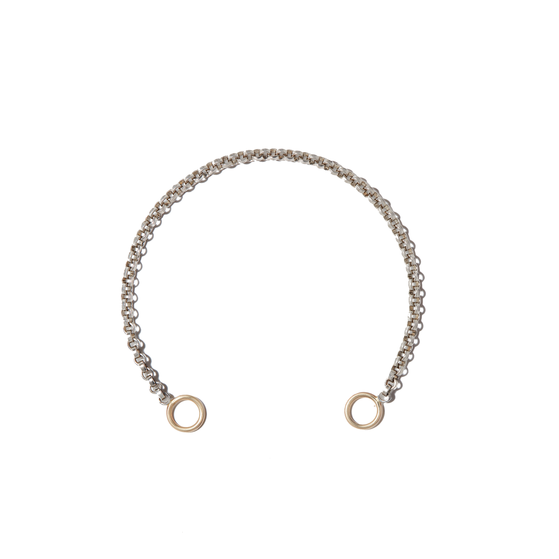 Silver rolo chain bracelet with gold loops against white backdrop