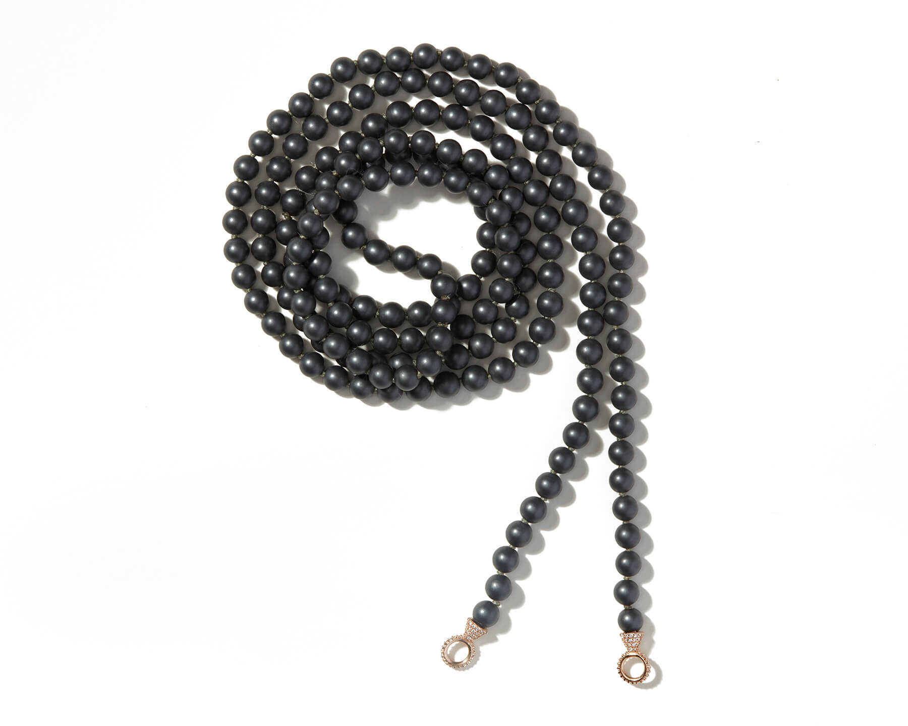 Curled up hematite necklace with stoned gold loops