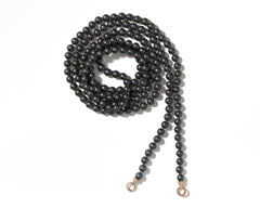 Curled up hematite necklace with stoned gold loops