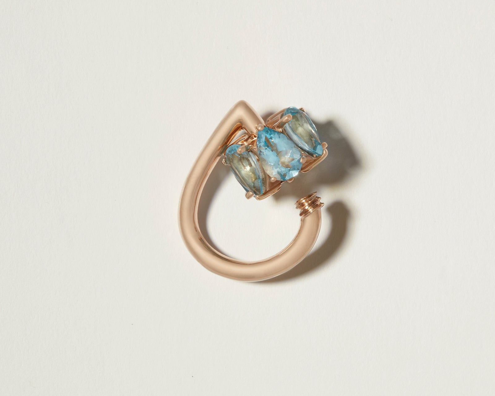 Gold droplock charm with open blue gemstone clasp