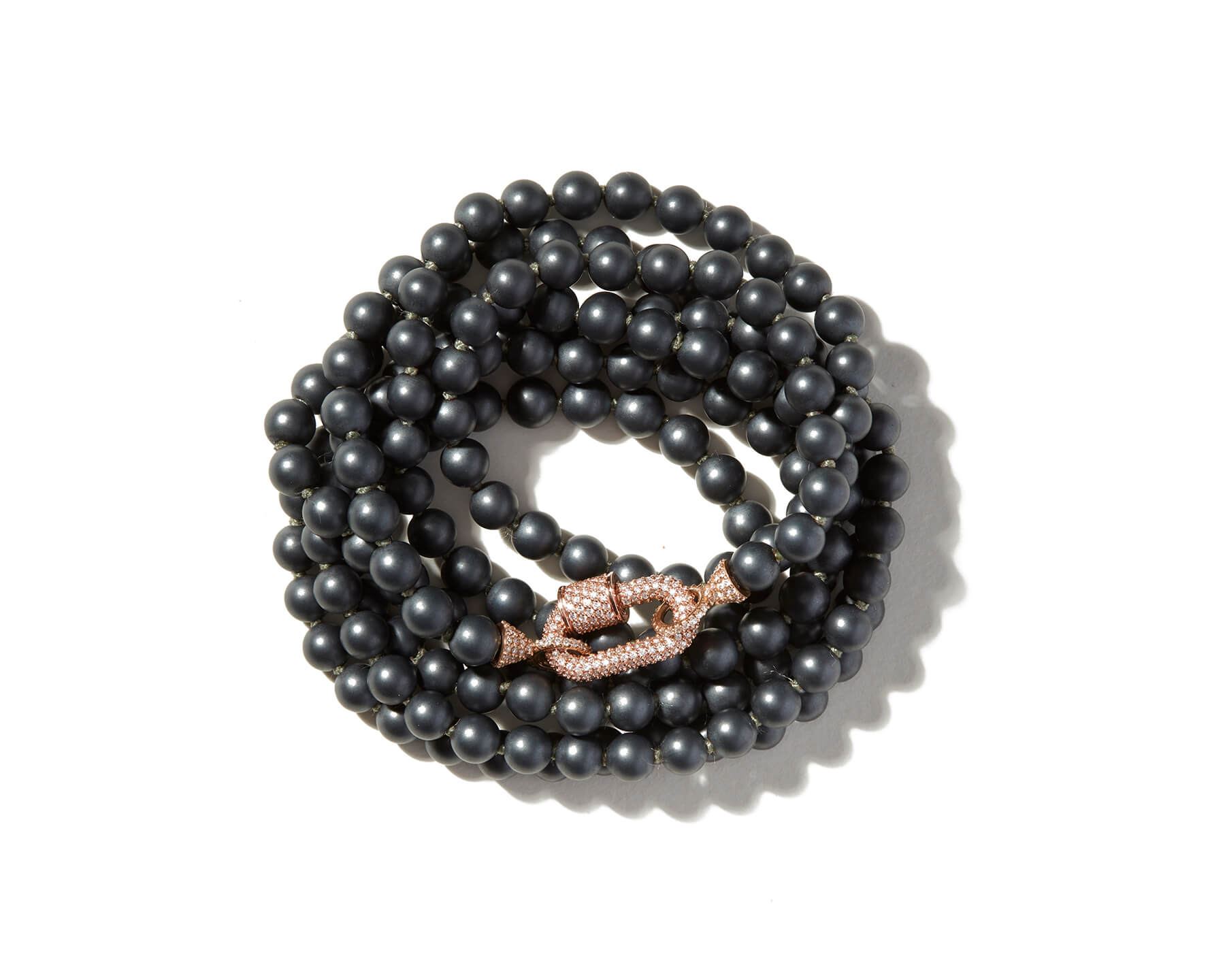 Curled up hematite crystal necklace with stoned rose gold lock