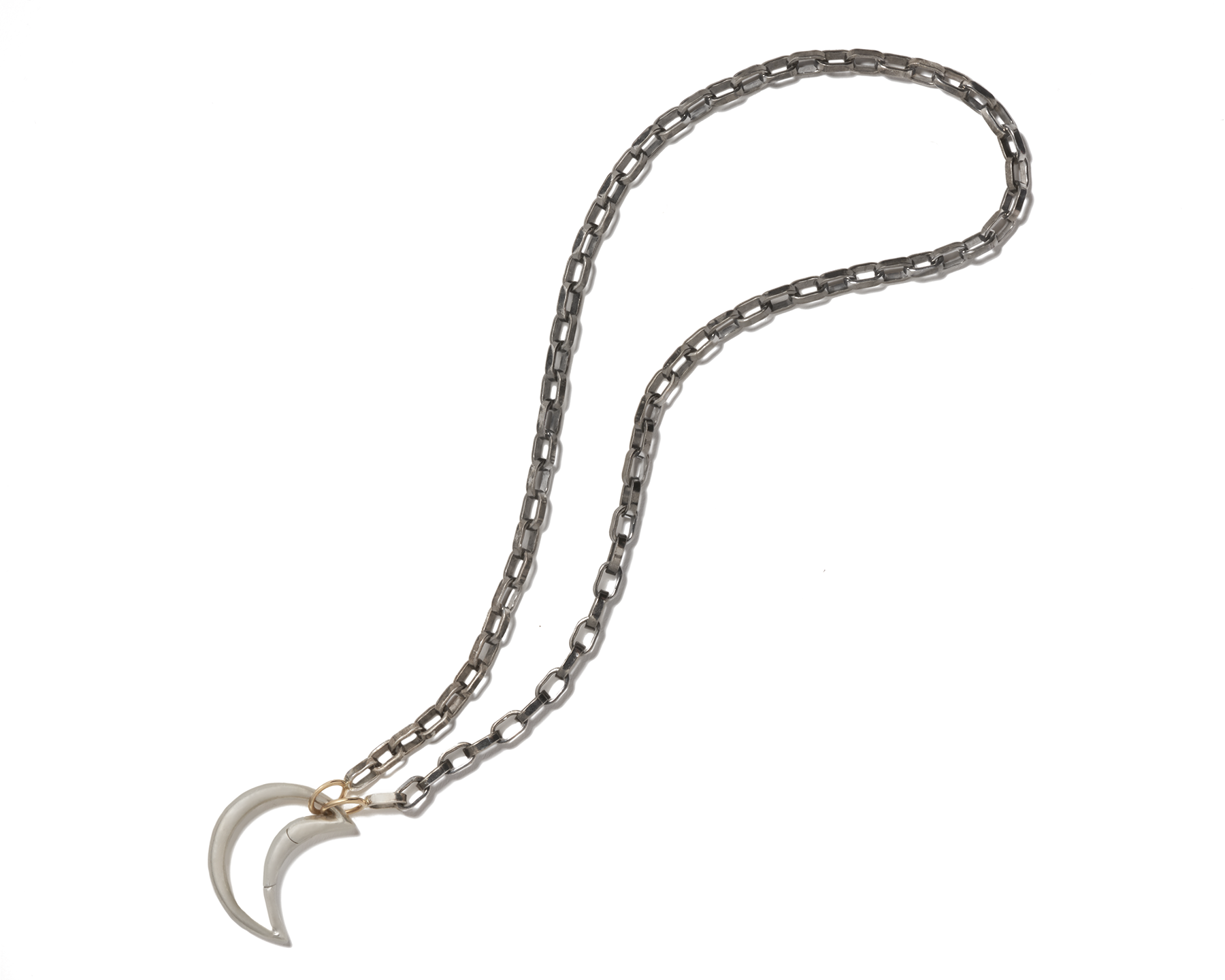 Sterling silver moon charm attached to black necklace chain against white backdrop