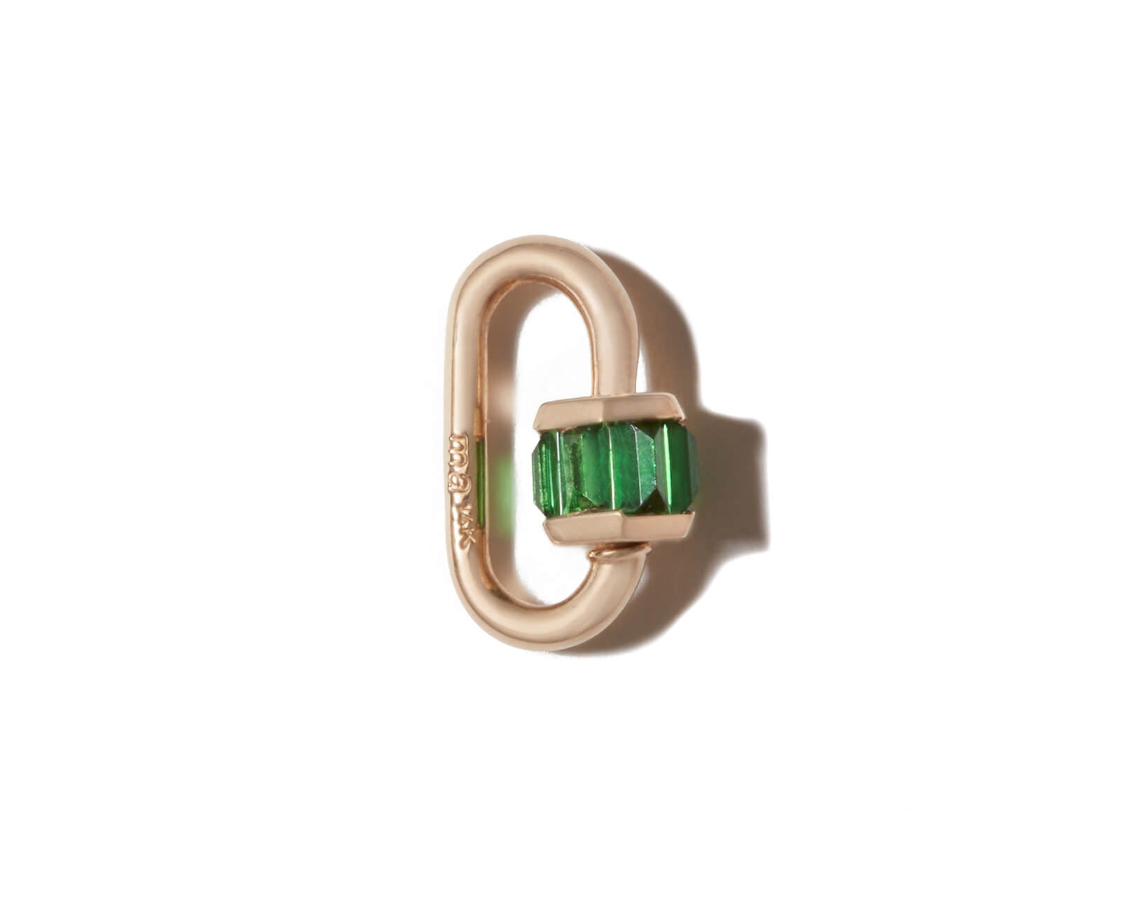 Green garnet charm lock against white backdrop 