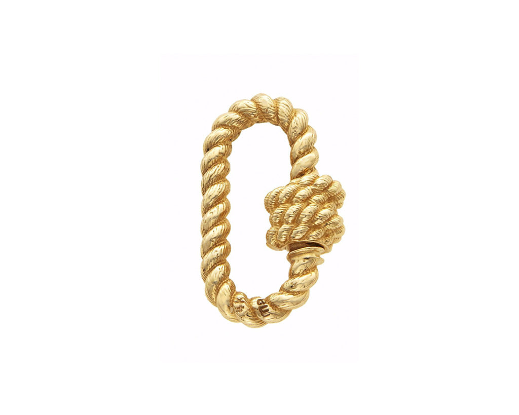 Rose gold twisted lock alongside yellow olive against white backdrop