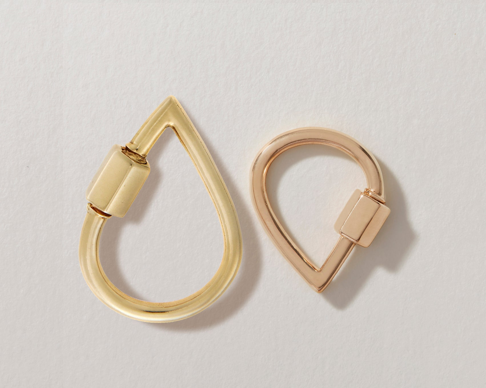 Large yellow gold droplock alongside rose gold small droplock