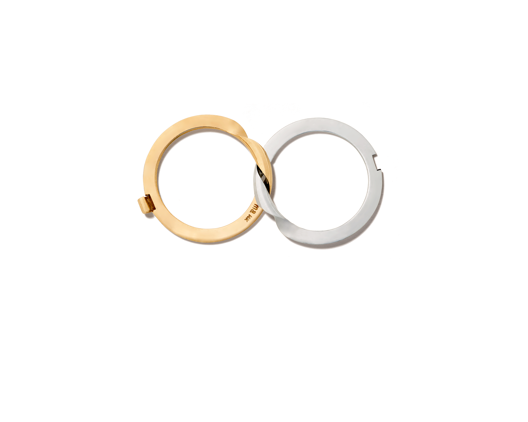 Aerial view of white gold and yellow gold intertwined rings