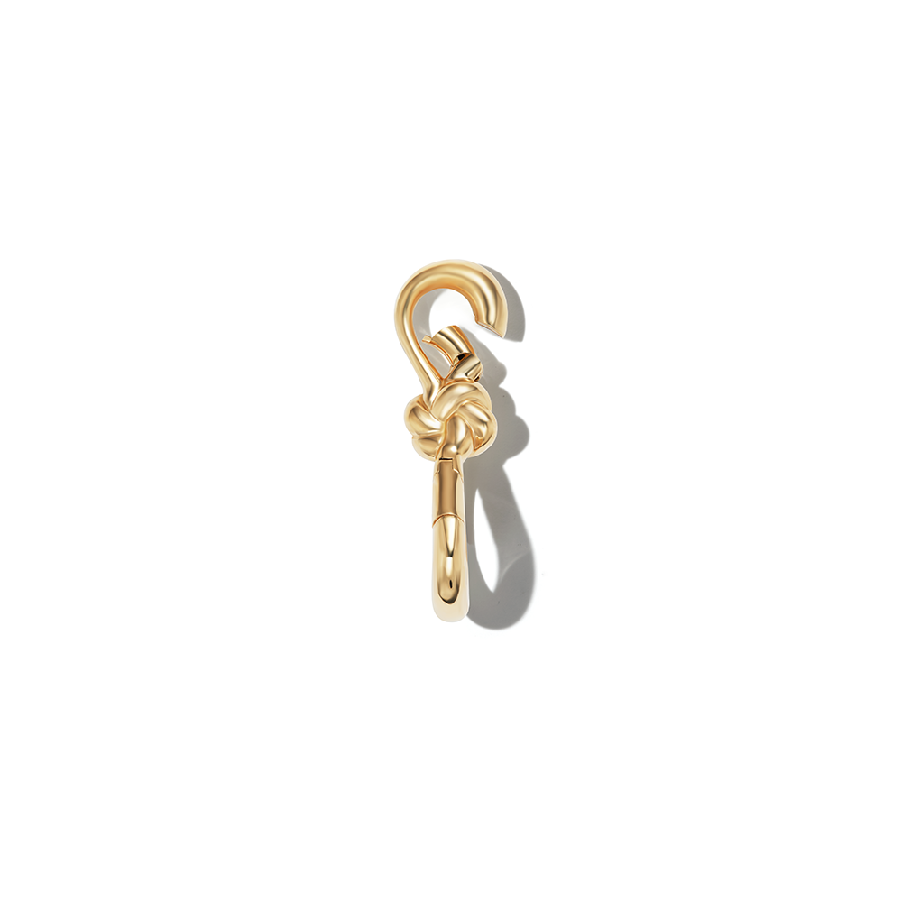 Gold love knot charm with open top clasp