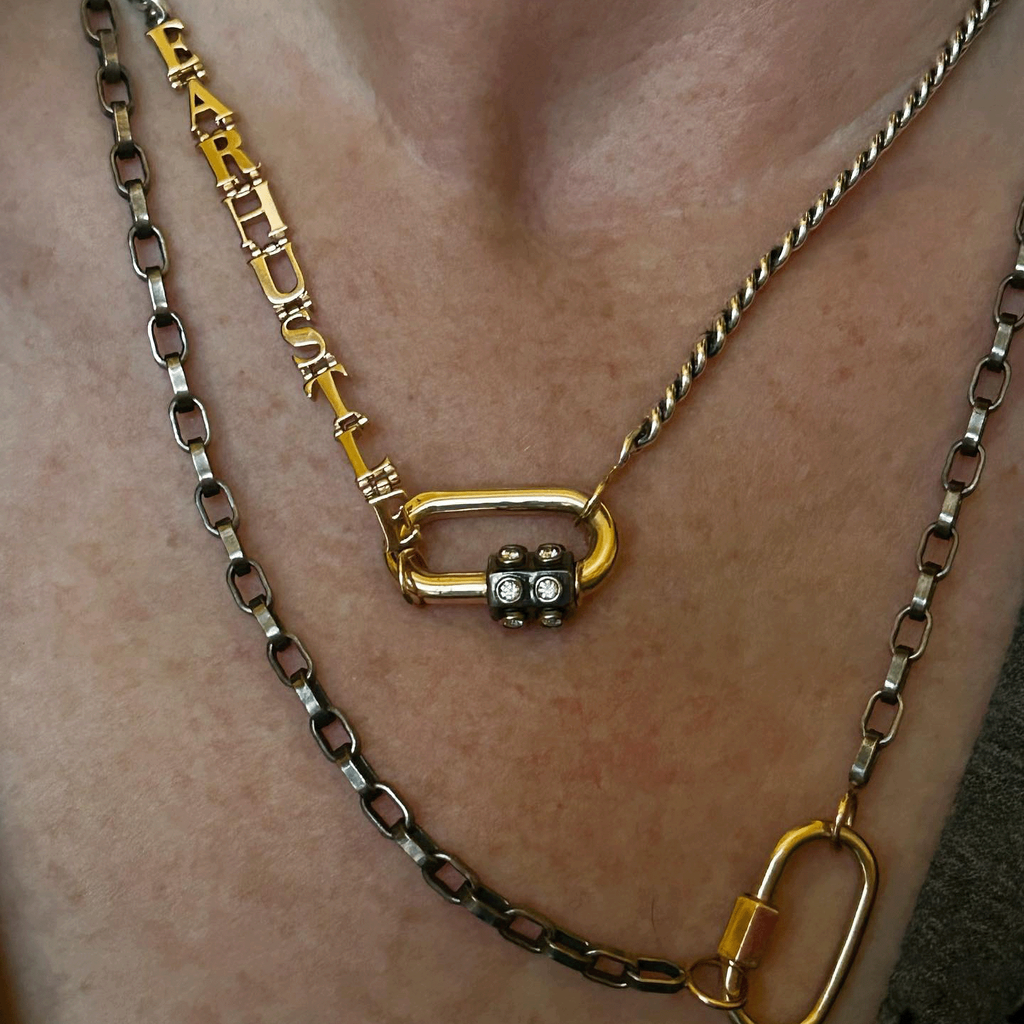 Close up of neck wearing blackened silver chain necklace
