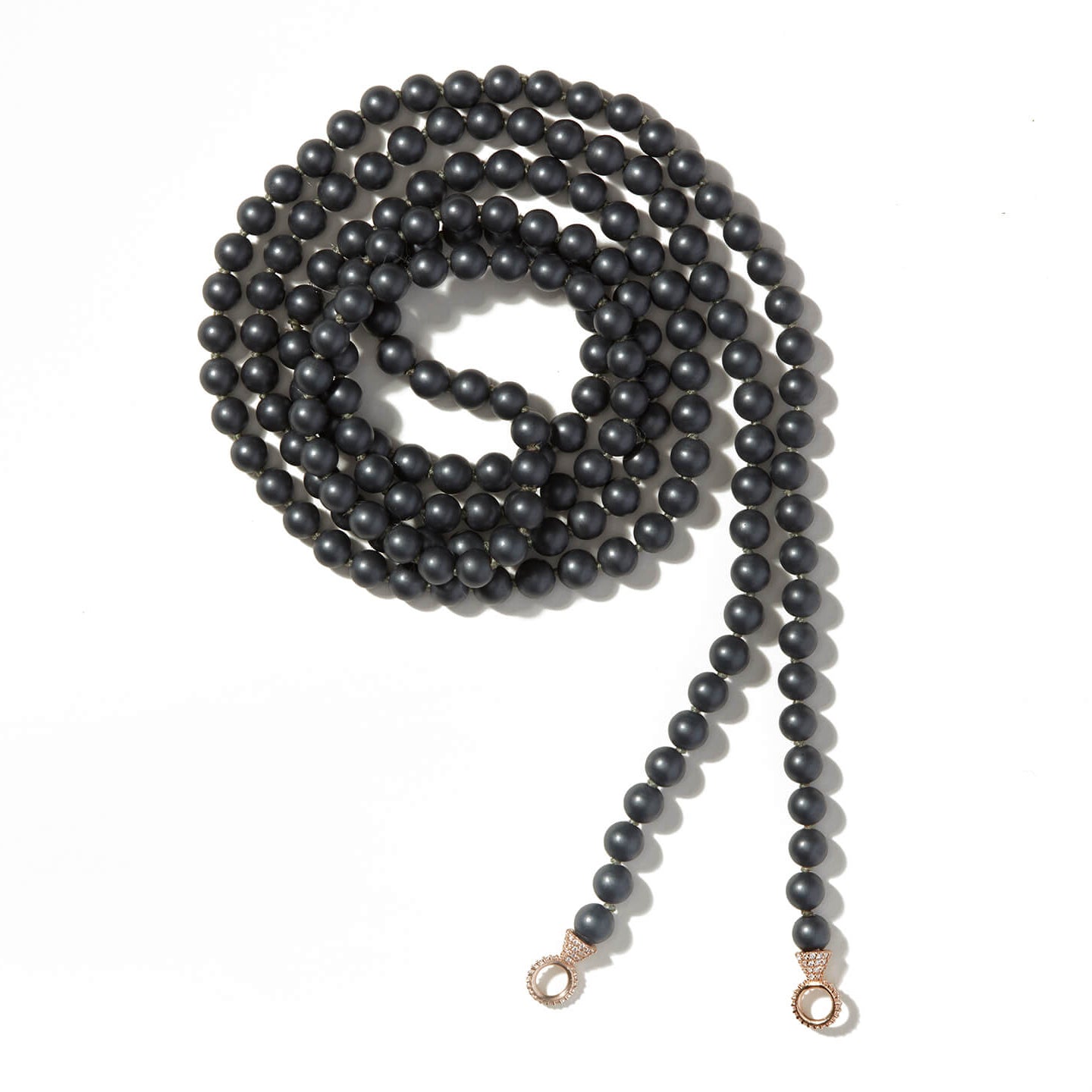 Curled up hematite necklace with stoned gold loops