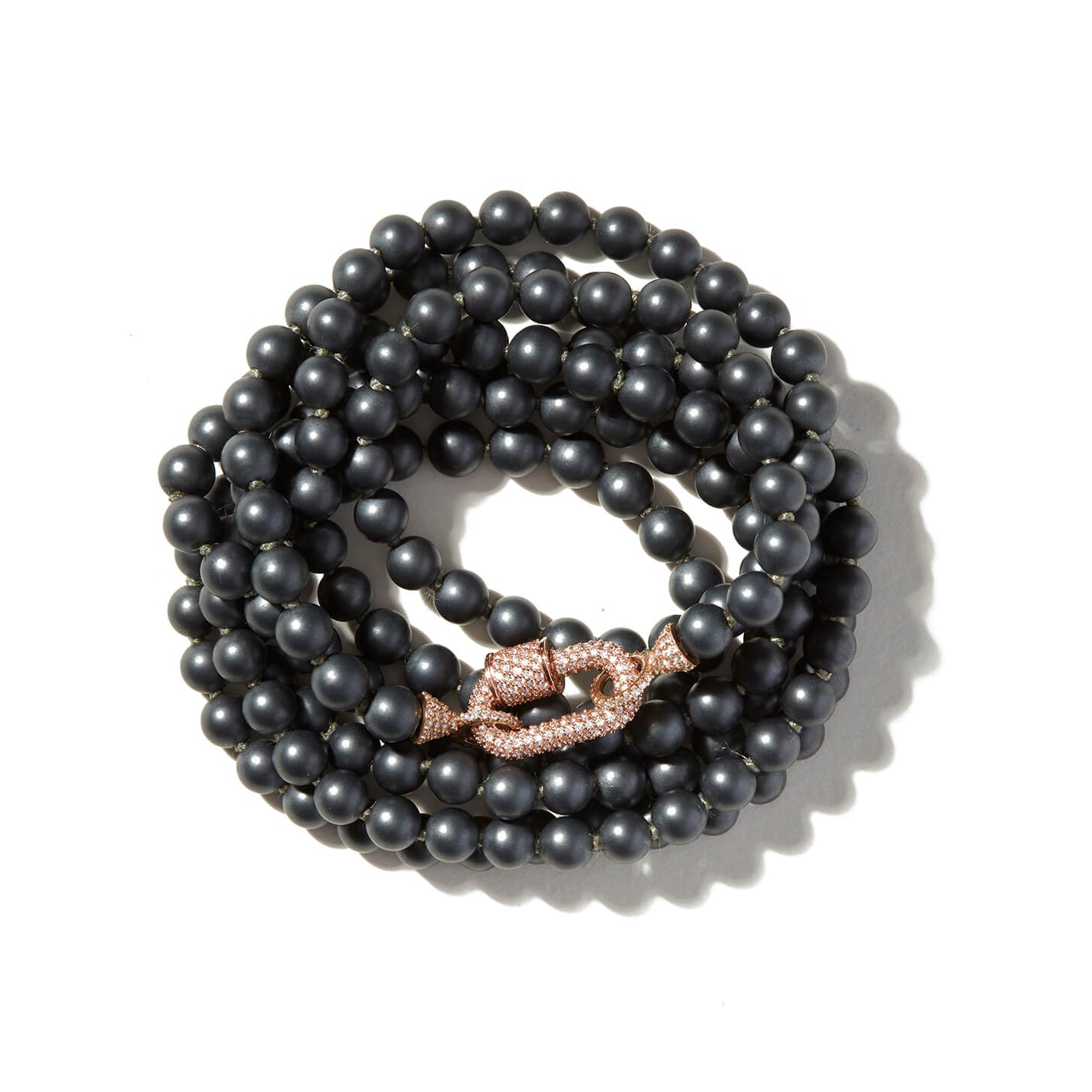 Curled up hematite crystal necklace with stoned rose gold lock