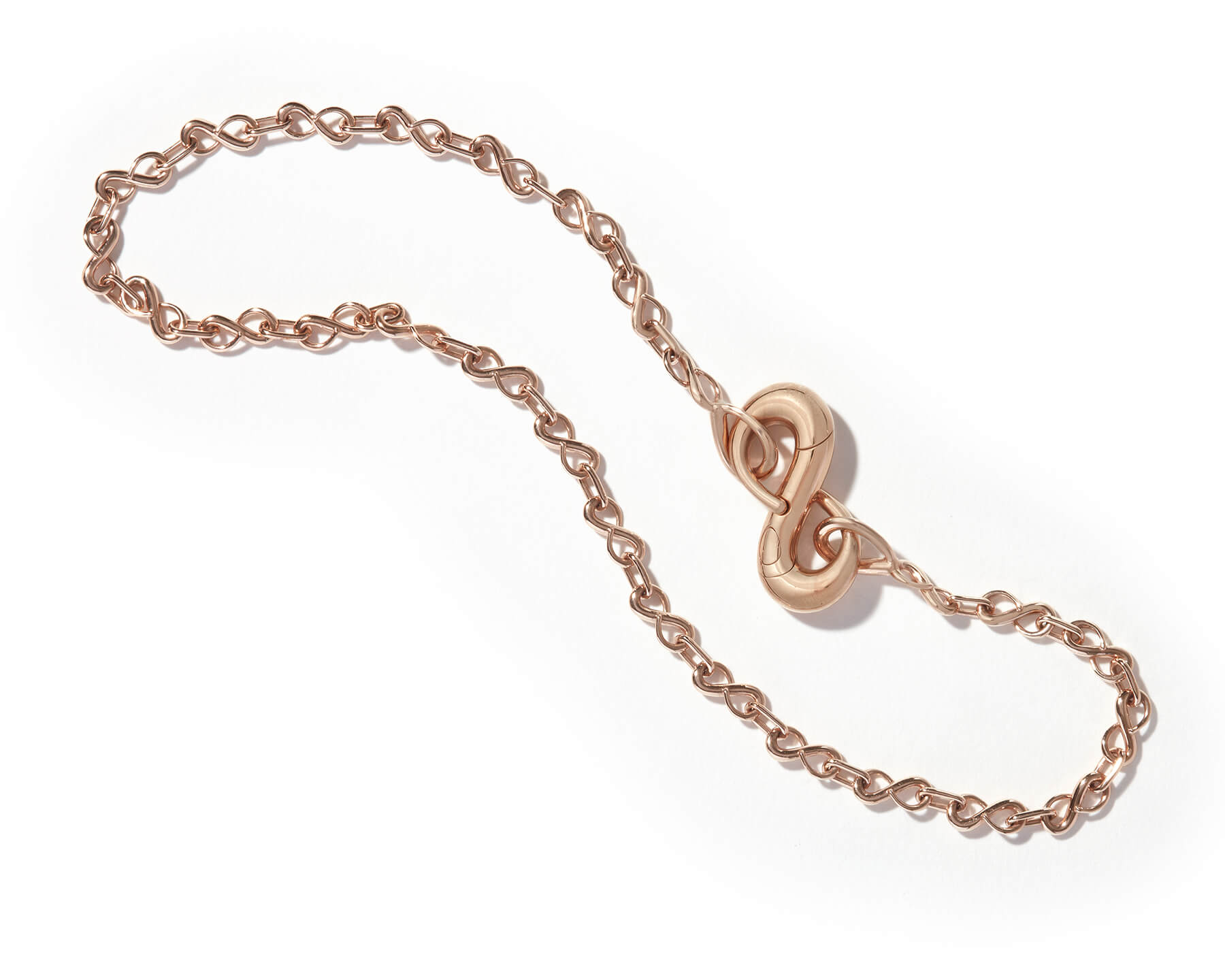 Rose gold infinity pendant on rose gold bracelet chain