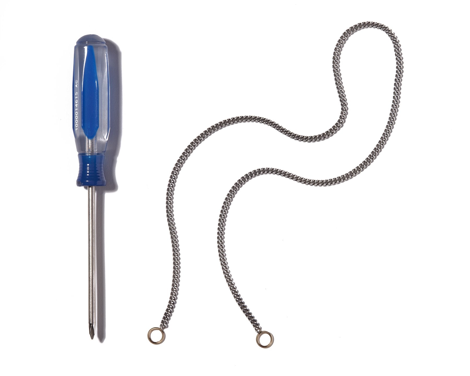 Curb chain bracelet alongside blue screwdriver