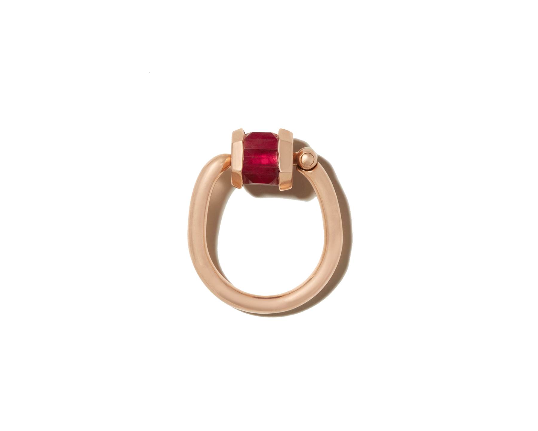 Rose gold ruby ring with trundle lock against white backdrop
