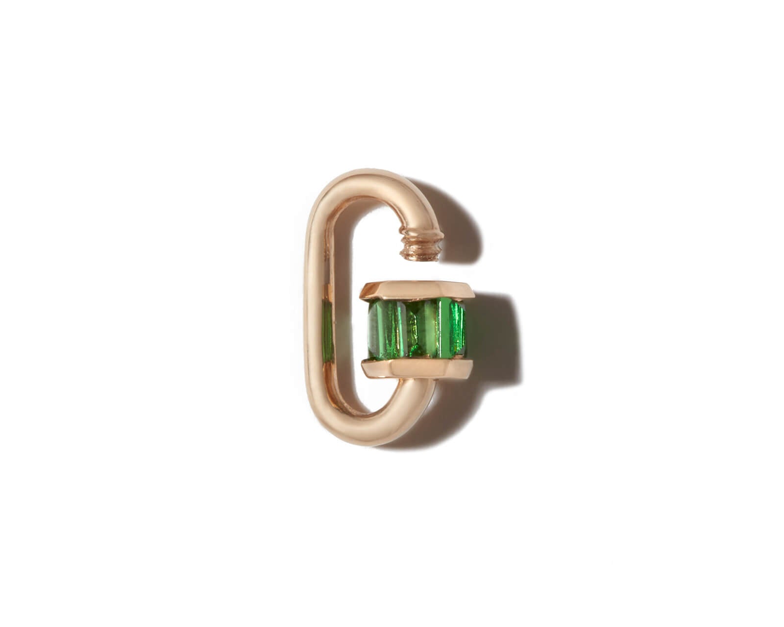 Green garnet jewelry lock with open clasp against white backdrop 