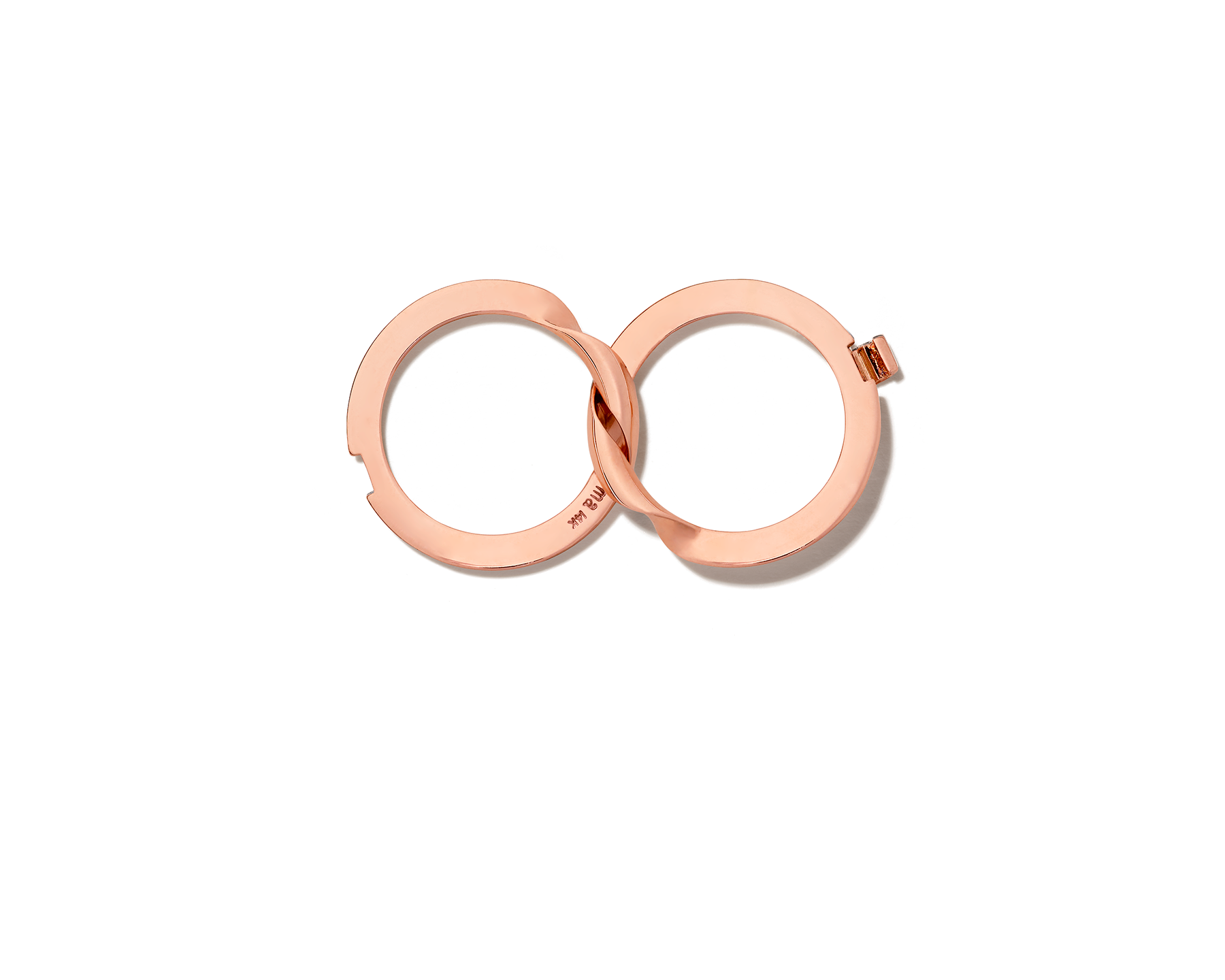 Aerial view of rose gold intertwined rings