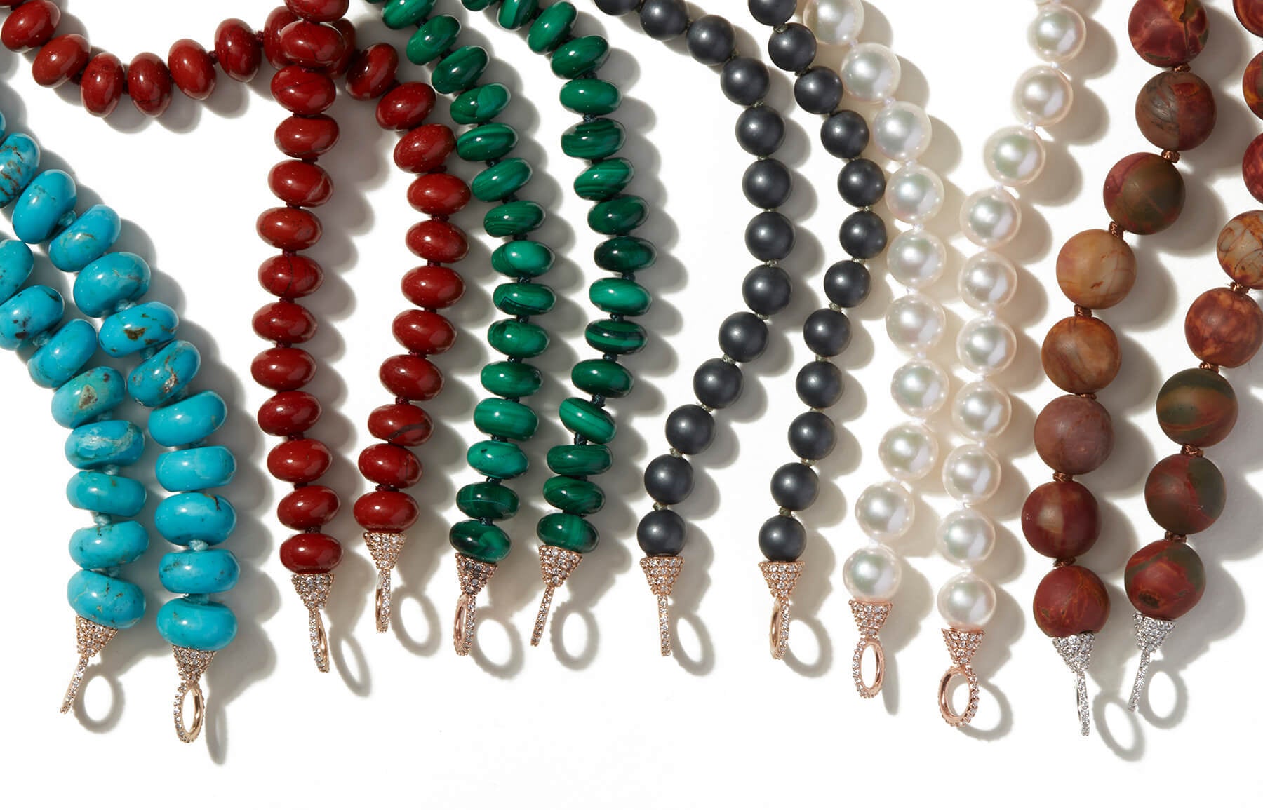 Line up of bead necklace strands including hematite bead necklace