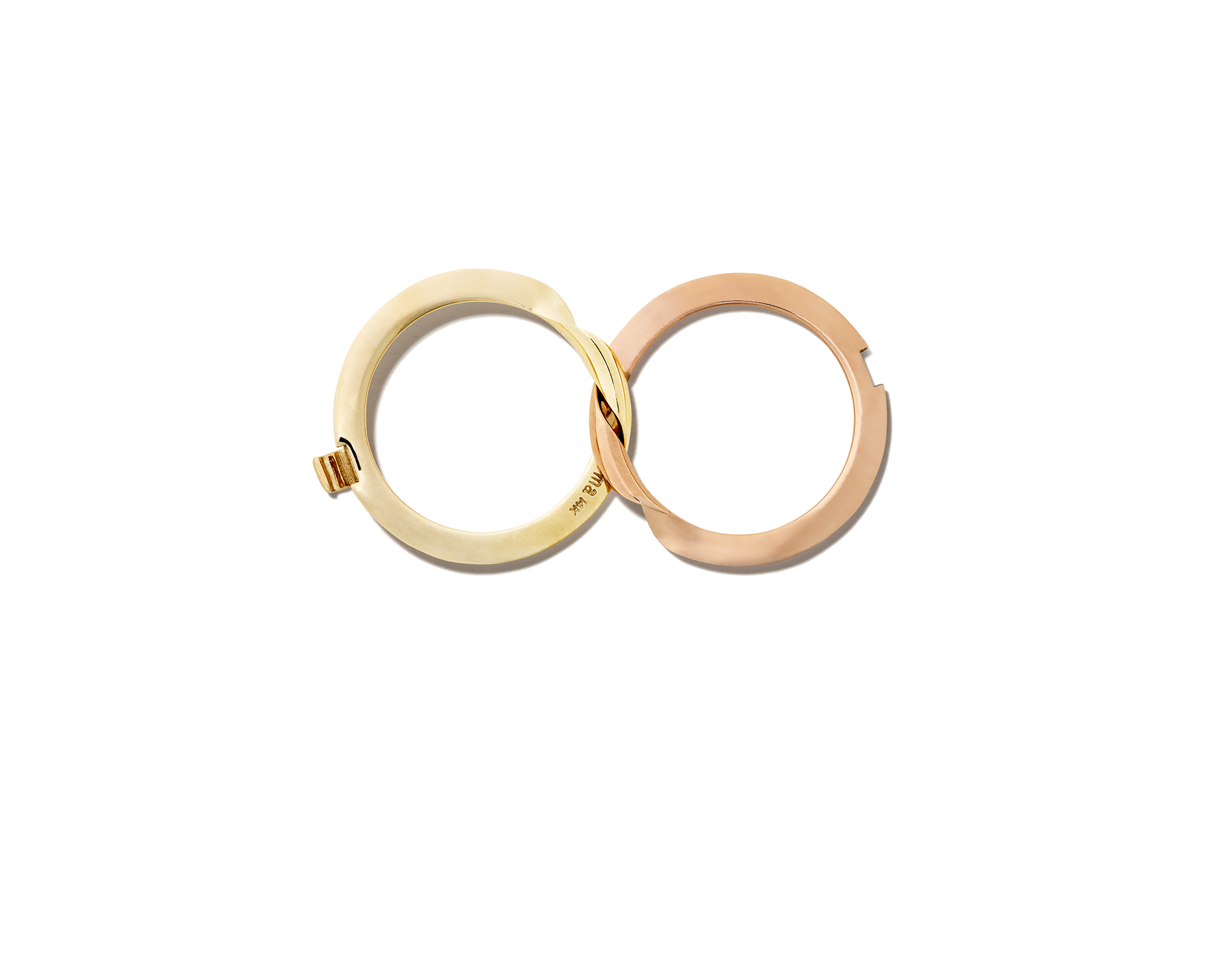 Aerial view of rose gold and yellow gold intertwined rings